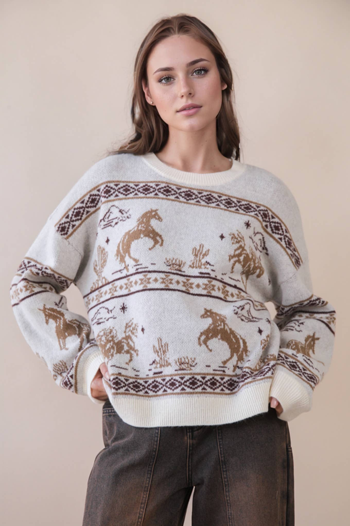 Woman wearing a western sweater with horse patterns. 