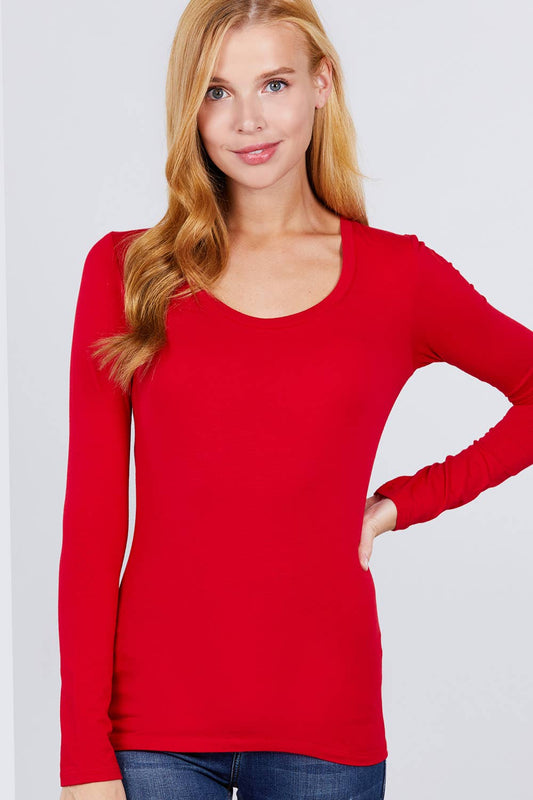 Woman wearing a red long-sleeve scoop neck top.